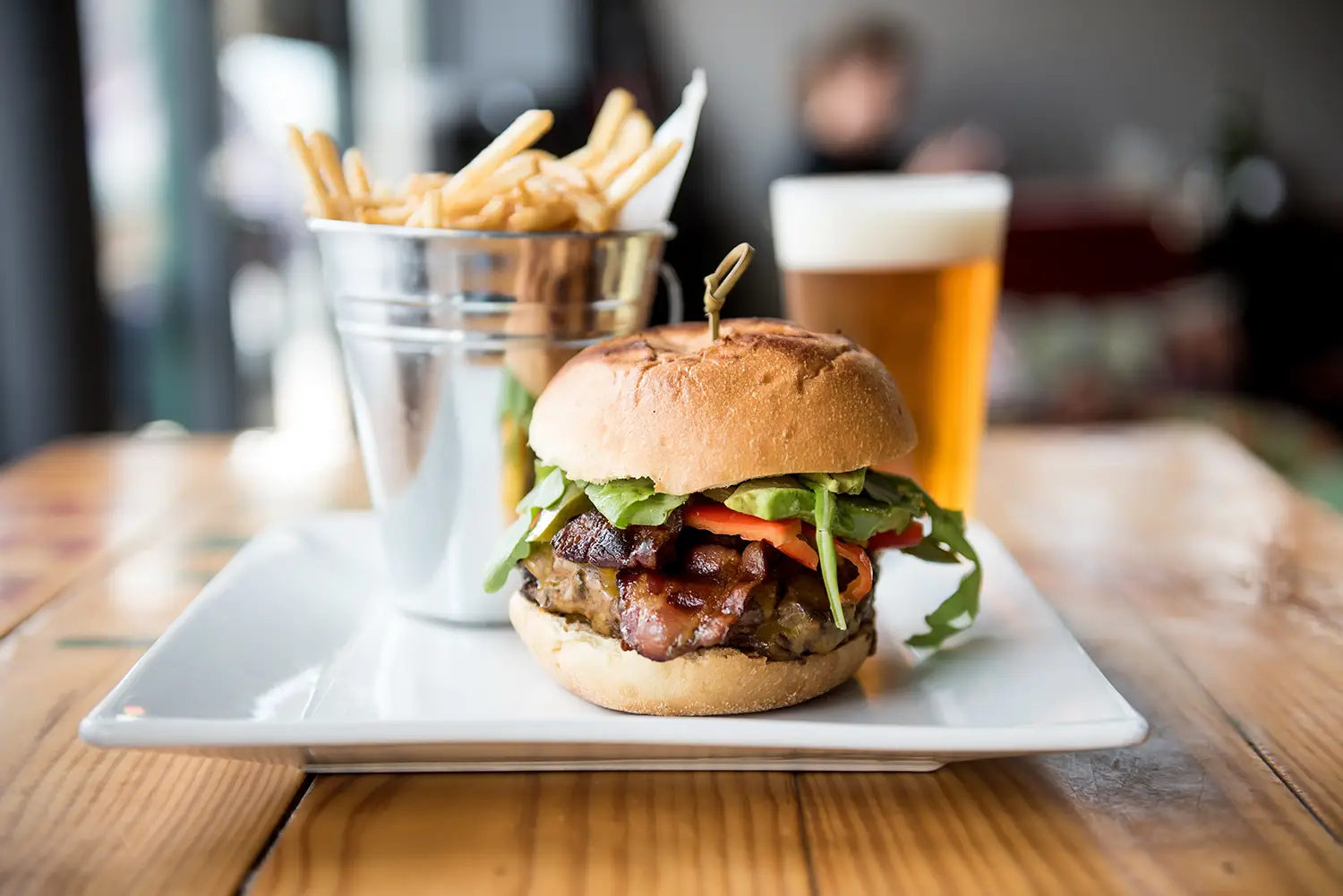 Hamburger on plate with Fries and Beer