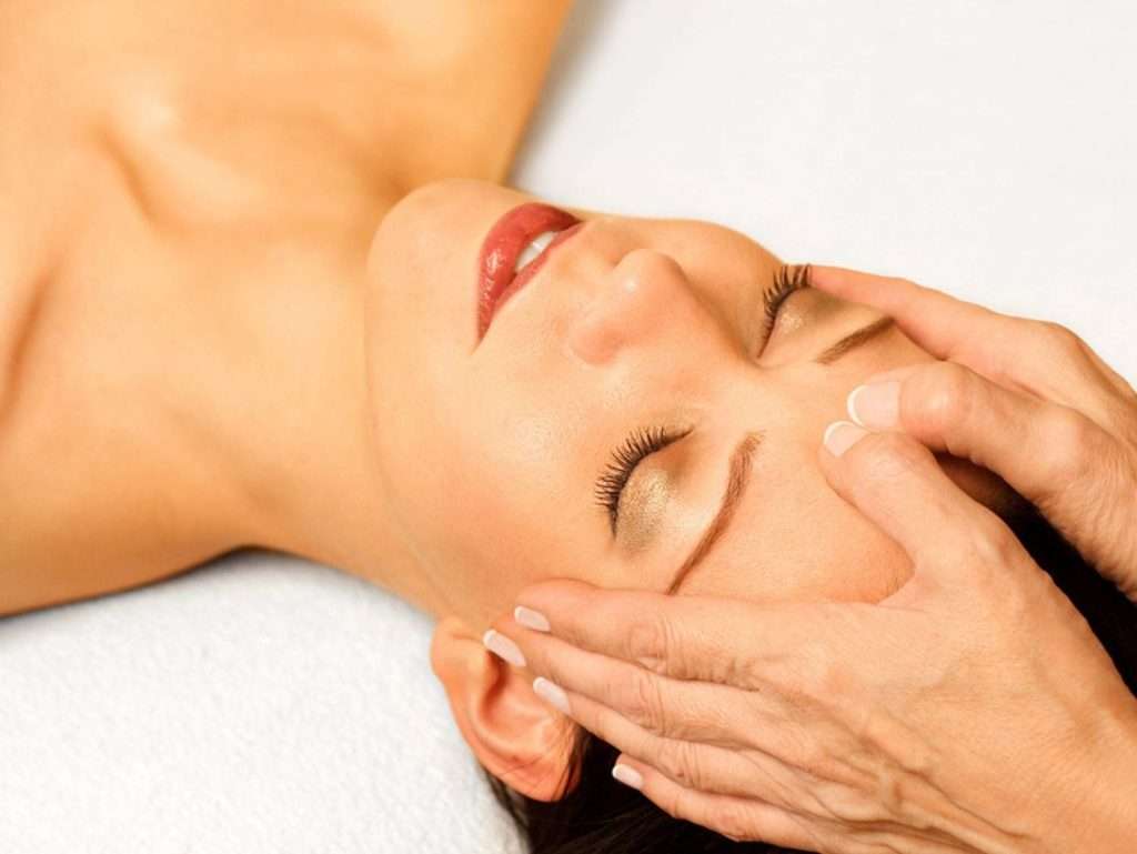 Woman receiving a head massage