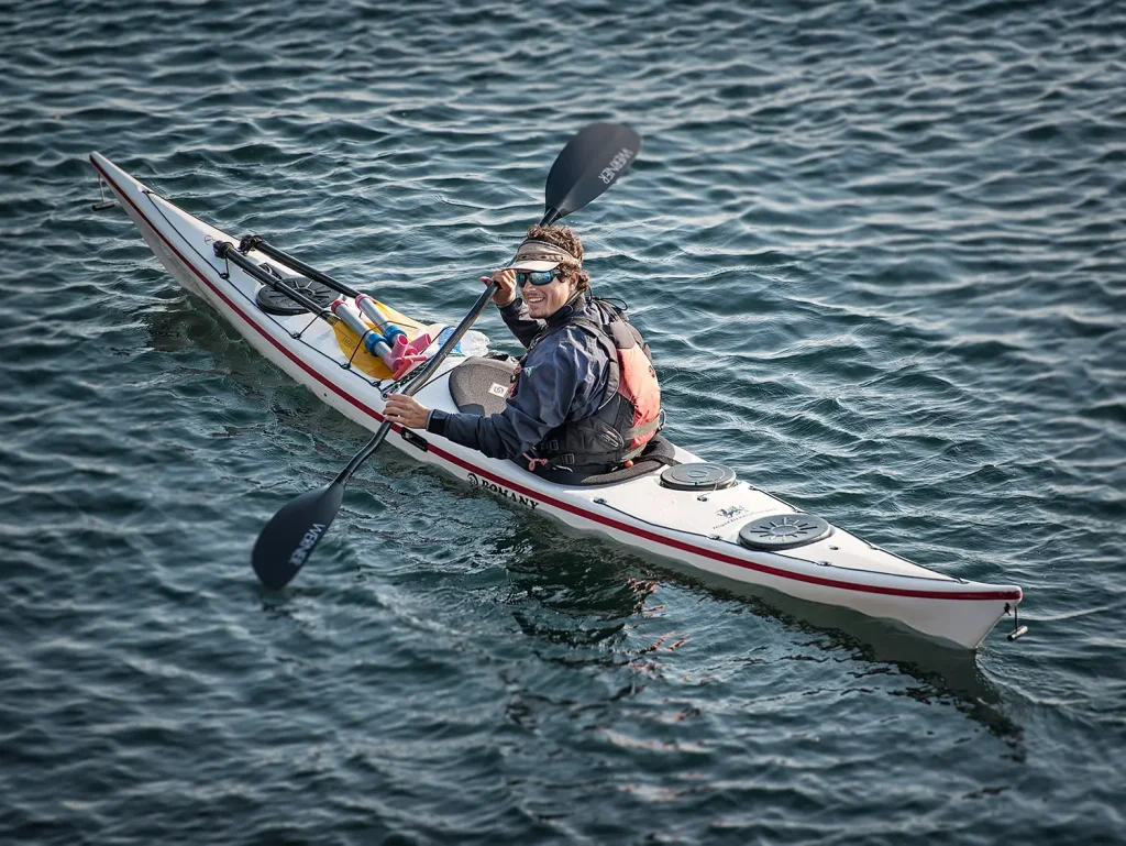 A kayaker kayaking in water